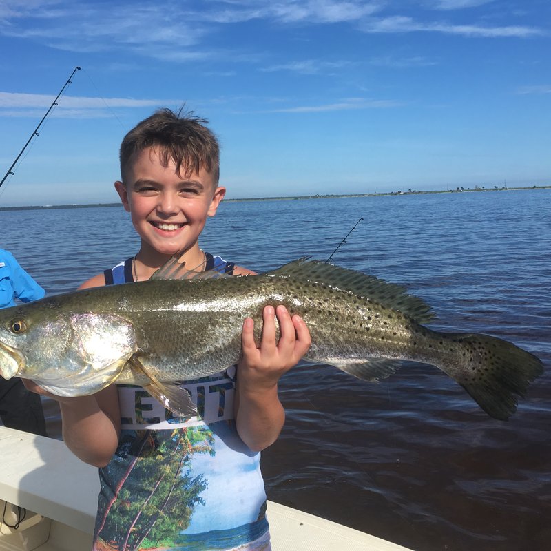 Group of anglers with their catch after a New Smyrna Beach fishing charter trip